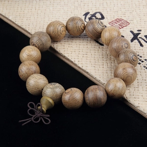 Detailed view of natural wood beads with oil line texture and Chinese knot gourd