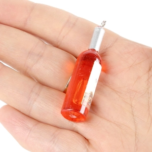 Colgante miniatura de botella de vino en resina naranja para creación de joyas