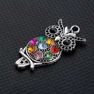 Retro silver owl necklace pendant featuring colorful rainbow rhinestones and black stone eyes