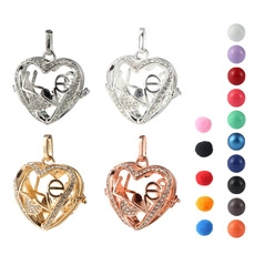 Detail view of heart-shaped LOVE locket pendants with sparkling rhinestones and metal finishes
