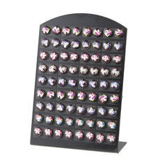 L-shaped black display stand holding over 70 colorful cartoon unicorn round badges