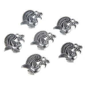Set of six antique silver peacock charms for DIY jewelry making with detailed feather texture