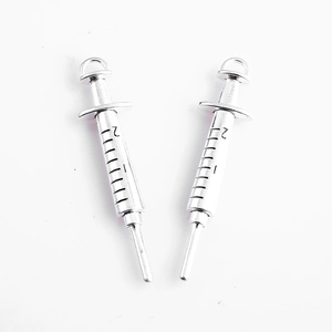 Pair of antique silver syringe charms with precise black scale markings for DIY jewelry