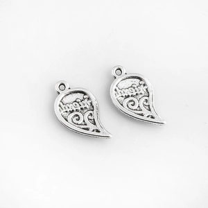 Paire de pendentifs puzzles en forme de cœur argenté avec gravure d'art Love