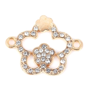 Vue détaillée du connecteur de bijou en forme de fleur dorée serti de strass brillants