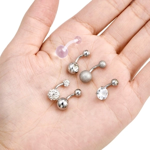 Set of 6 stainless steel and acrylic navel rings with cubic zirconia in a hand display