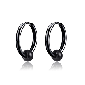 Macro shot of polished black stainless steel hoop earrings with round bead charms