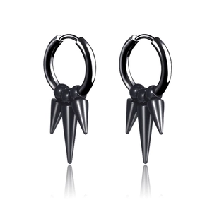 Detail view of black punk hoop earrings with three spikes and a polished finish