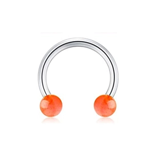 Macro detail of horseshoe septum ring with polished steel bar and translucent orange beads