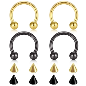 Detailed set of horseshoe nose rings and spikes in polished gold and black finishes
