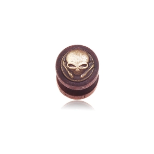 Gothic wood ear plug featuring a vintage gold alien skull and crossbones relief