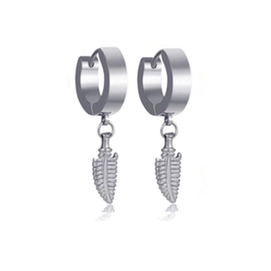 Detail view of silver hoop earrings featuring textured leaf feather pendants on a white background