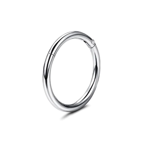 Detailed macro view of a 316L stainless steel hinged segment ring for nose or lip piercing