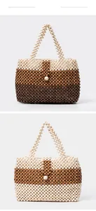 Detailed macro view of handmade wooden bead handbags with color blocking and fabric lining