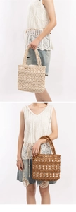 Detail of hand-woven wooden bead tote bags in cream and brown with floral cutout patterns