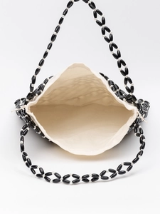 Handmade bohemian beaded handbag in black and white with a canvas interior lining