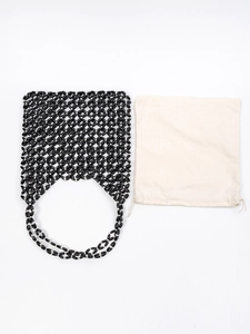 Handmade black beaded tote bag with dual top handles and cream drawstring inner pouch