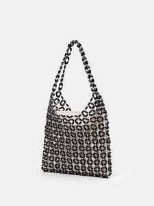 Handwoven black and white beaded shoulder bag with diamond grid pattern and inner lining