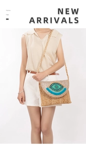 Detail of handmade jute crossbody bag featuring a beaded evil eye embroidery motif