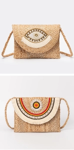 Detail of bohemian jute bags with sequin eye patch and shell floral tassel design