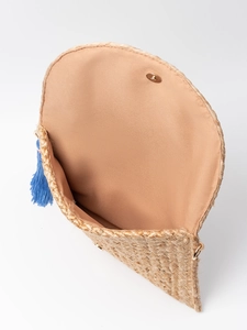 Handmade woven jute clutch with bright blue tassel and magnetic closure for beach travel