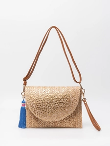 Handmade jute crossbody bag with gold-tone flap and a blue tassel for summer vacations