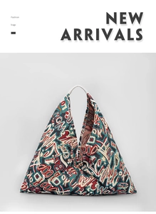 Detailed texture of triangle knitted tote bag with colorful graffiti jacquard pattern