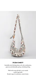 Detail of bohemian canvas hobo bag with Egyptian cat prints and wooden strap rings