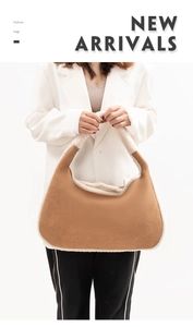 Detail of camel suede Hobo bag with white plush sherpa trim and smooth top handle strap