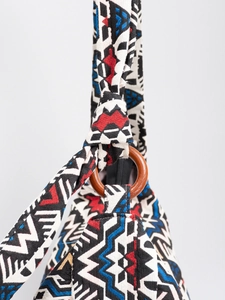 Bohemian canvas shoulder bag with geometric patterns and natural wood ring detail