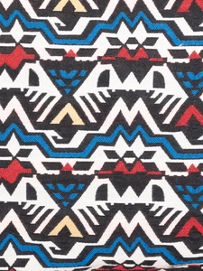 Bohemian style woven canvas bag with geometric tribal patterns and zipper closure