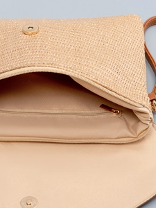 Beige straw woven crossbody beach bag with magnetic buckle and interior zipper pocket