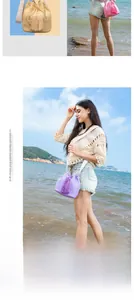 Detail of woven straw bucket bag with tassel drawstring and geometric shoulder strap