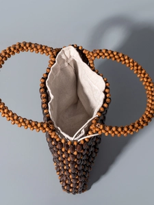 Handmade contrast color wooden bead tote bag with drawstring inner pouch for beach holidays