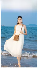 Detail of hand-woven brown wooden bead bag with a long shoulder strap for beach holidays