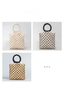 Close-up of handmade beaded handbags with geometric patterns and round top handles