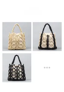 Detail view of handmade hollow bead handbags in pearl white, black, and bicolor options