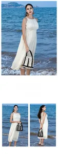 Close-up of handmade hollow wood bead handbag with contrast geometric pattern