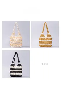 Detailed view of handmade woven beaded handbags in cream, mustard yellow and black patterns