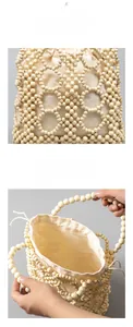 Detail view of the wooden bead weaving texture and cream canvas lining of the beach handbag