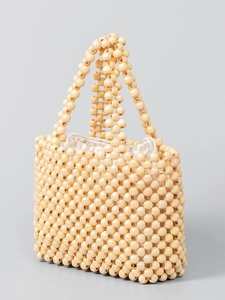 Handmade wooden bead tote bag with woven handles and white drawstring liner for beach