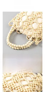 Detailed view of handmade hollow wooden bead bag with a natural texture and fabric liner