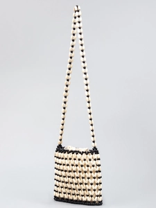 Handmade beaded beach bag with black and white woven lattice pattern and long strap