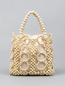 Hollow out ivory wooden bead handbag with drawstring canvas liner for beach vacations