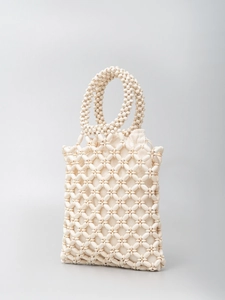 Handmade cream beaded tote bag with hollow diamond pattern and drawstring inner pouch
