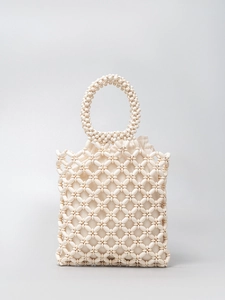 Handmade cream wooden beaded handbag with geometric hollow pattern and drawstring liner