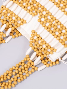 Handcrafted woven bead handbag with yellow and ivory geometric pattern for beach vacation