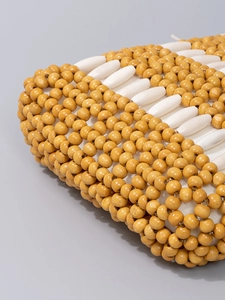 Handmade hollow beaded tote bag in yellow and ivory for beach vacation and summer travel