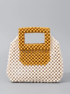 Handmade beaded handbag with contrast mustard yellow and white wood beads for beach vacations