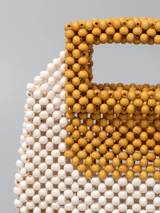Handmade beaded evening bag with yellow and white color-block design for summer vacation